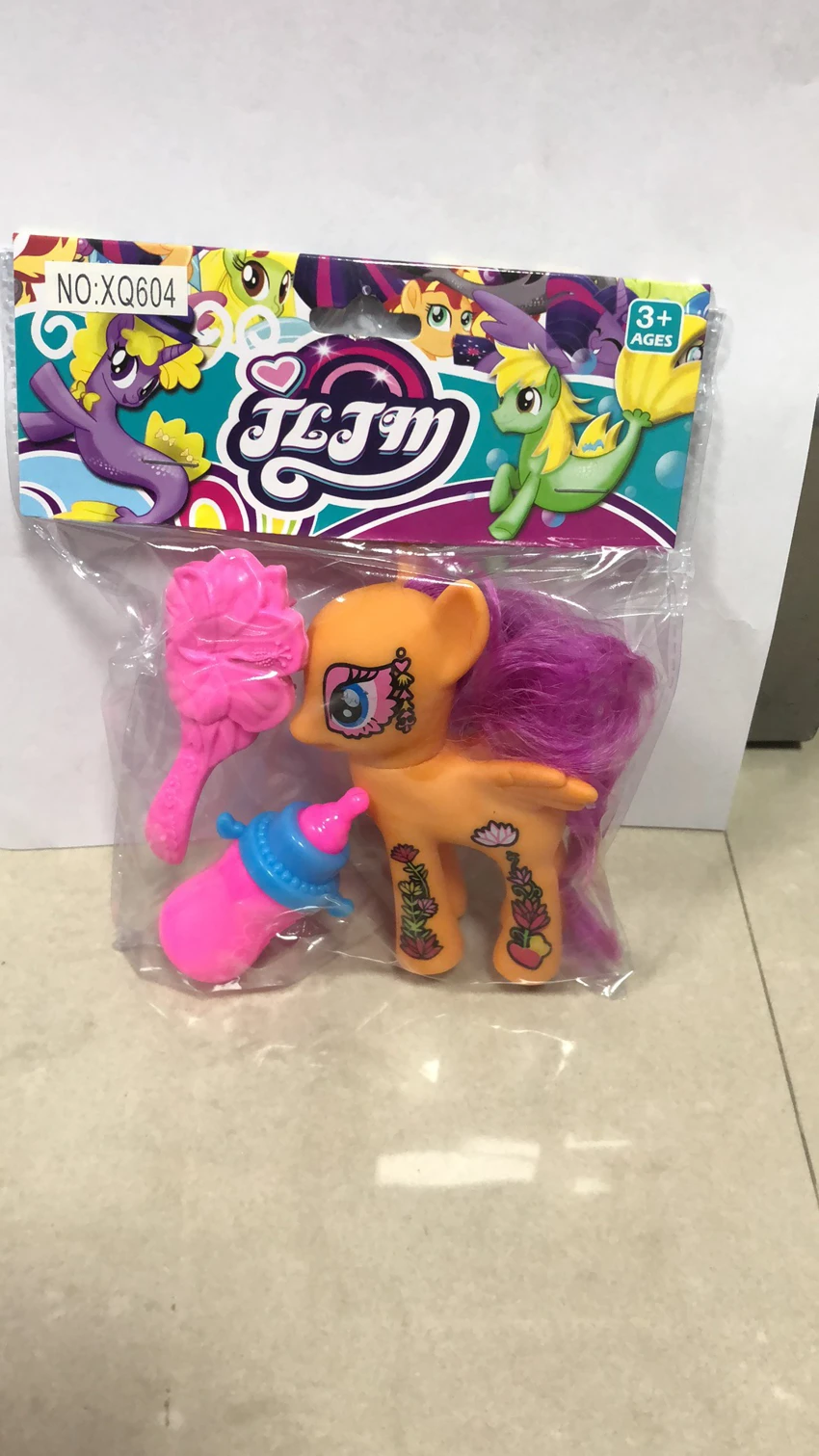 Patterned horse baby bottle comb hair clip